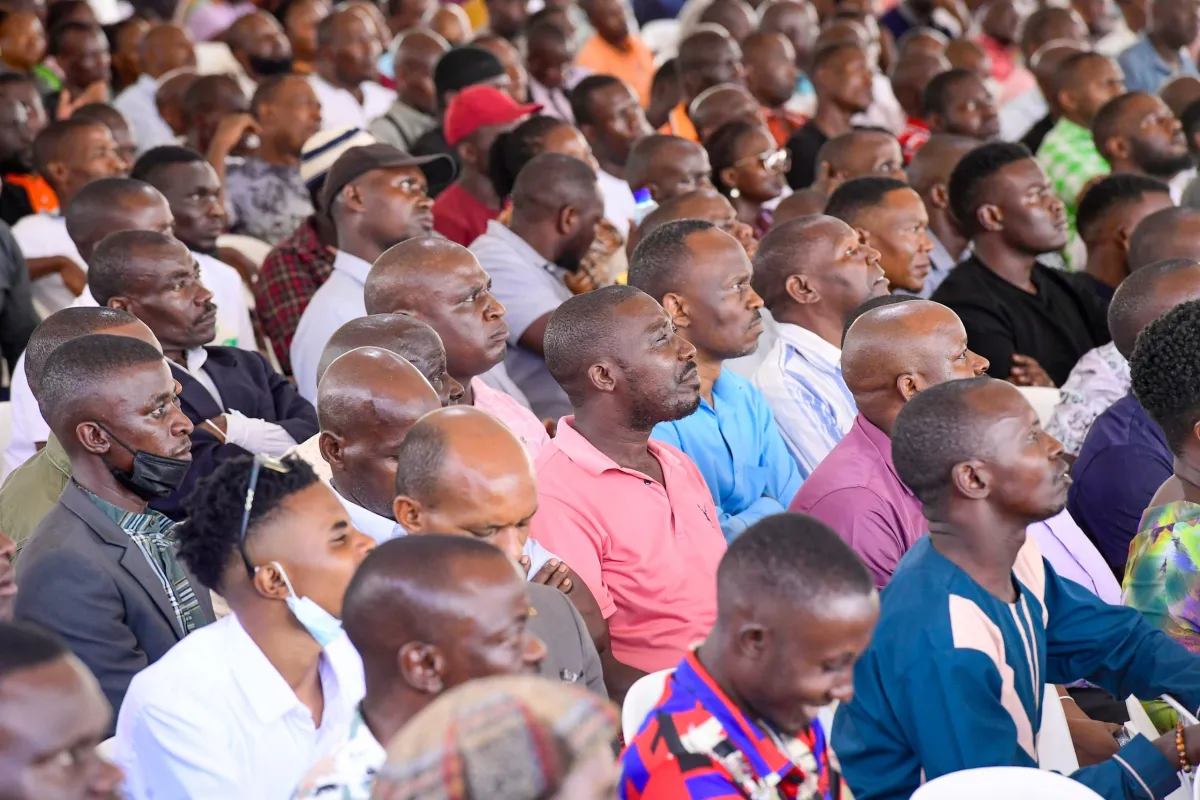 Traders listening to Museveni at Kololo at the past event.webp