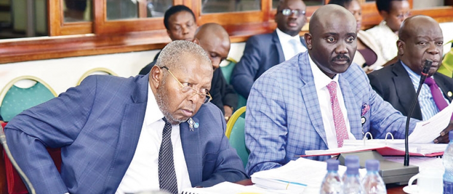 BOU Governor Mutebile L with Twinemanzi Tumubweine R next to him