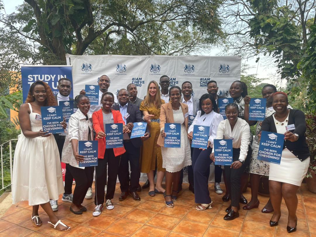 Deputy British High Commissioner Tiffany Kirlew with 20 Ugandan scholars bound for the UK under the