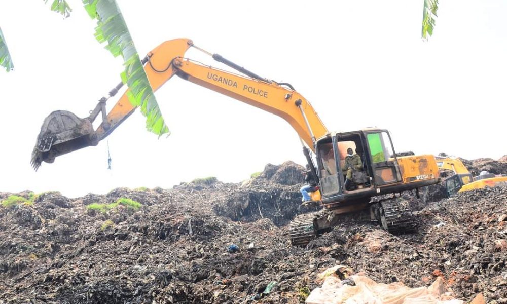 Excavators dig through garbage at Kiteezi Landfill on August 14 2024