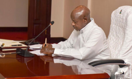 President Museveni signing a document dailyexpress