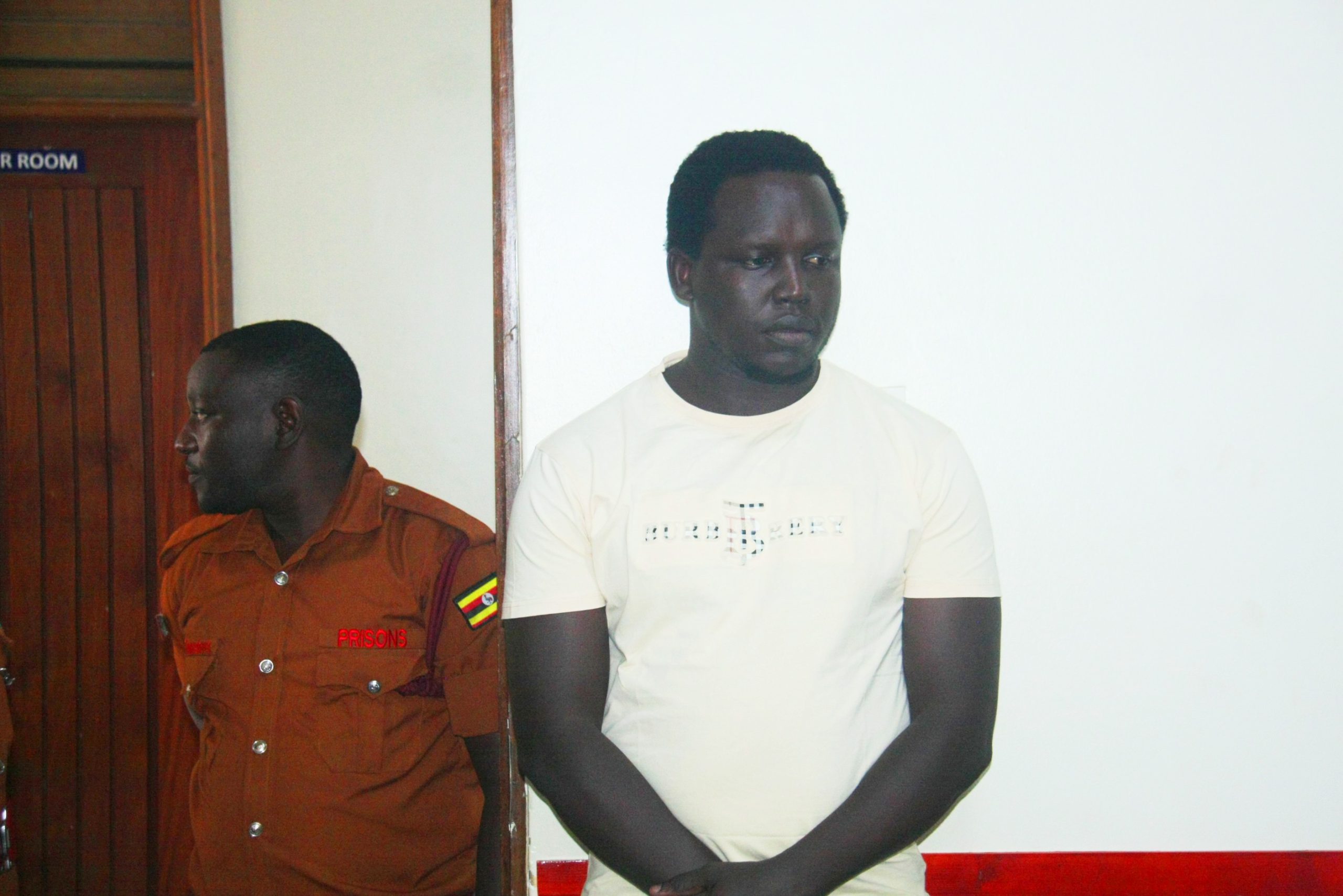 Rev Fr. Dominic Alinga freezing in court dock scaled