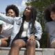 Teenage black girls spending time together outdoors weight issues