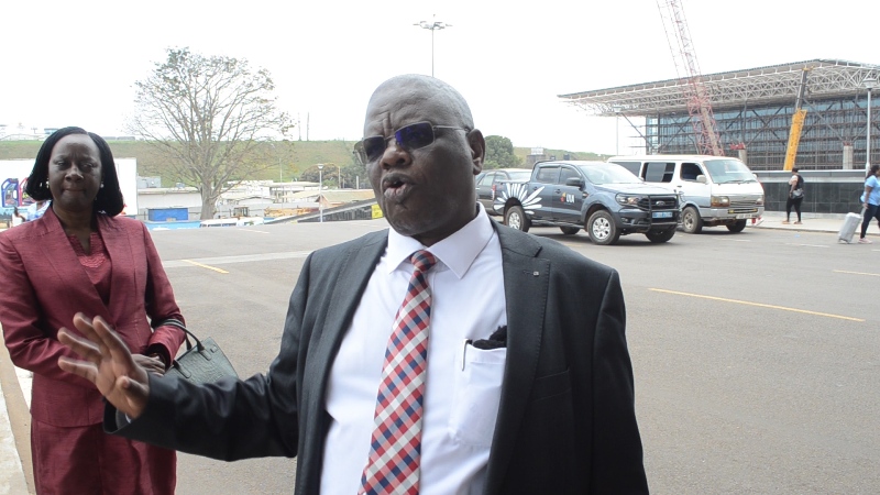 UCAA boss Fred Bamwesigye stressing a point as his deputy Olive Birungi Lumonya listens