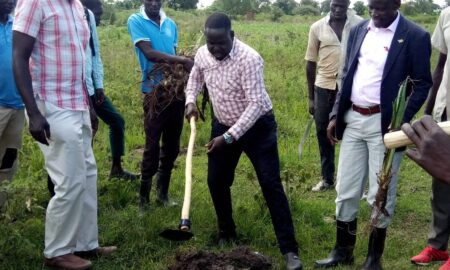 Deputy RDC Okwi V environmnet offficer LC3 Ojula Elvis WWF staff locals during demarkation of Wetlan