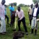 Deputy RDC Okwi V environmnet offficer LC3 Ojula Elvis WWF staff locals during demarkation of Wetlan