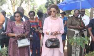 Lady Sylivia Naginda in the middle being welcomed at Lake Victoria school