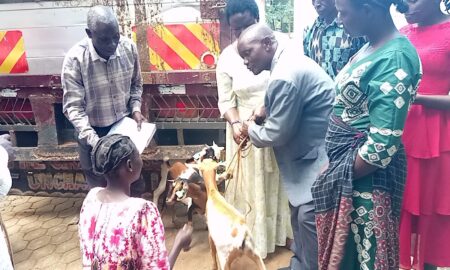 Ms Akello handing over goats to beneficiary Photo By George Emuron 1 e1726043754393