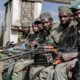 Two armies accused of backing DR Congos feared rebels .webp